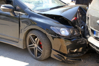 A car that is heavily damaged after a collision.