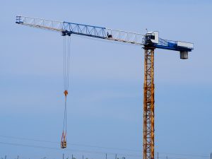 A yellow, blue, and white crane